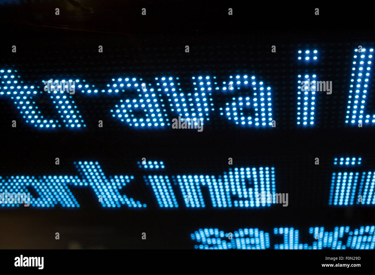 Led display with words travail and working with black background Stock Photo