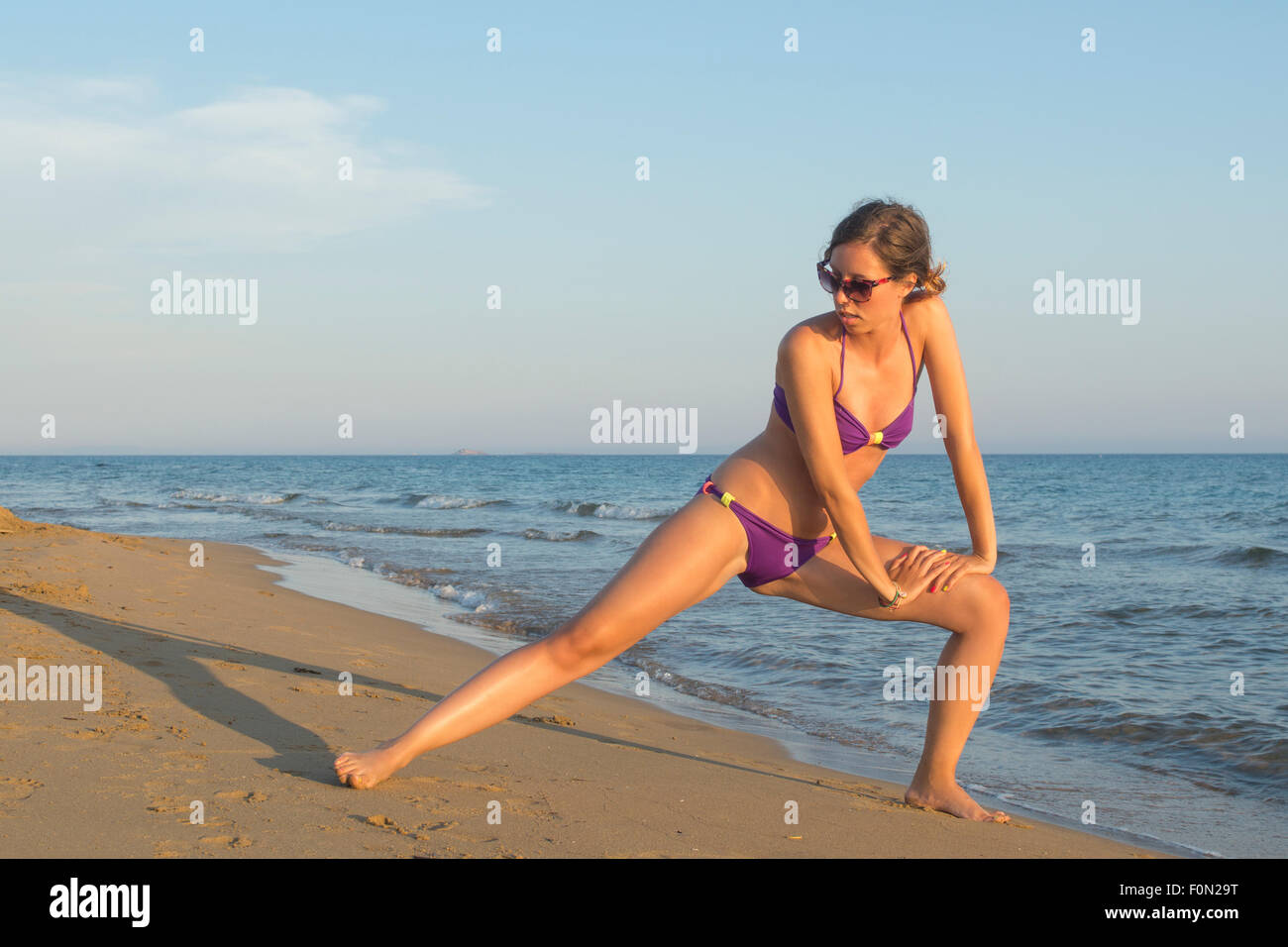 Young Girl Walking On The Beach In A Swimsuit 5884988 Stock Photo At  Vecteezy
