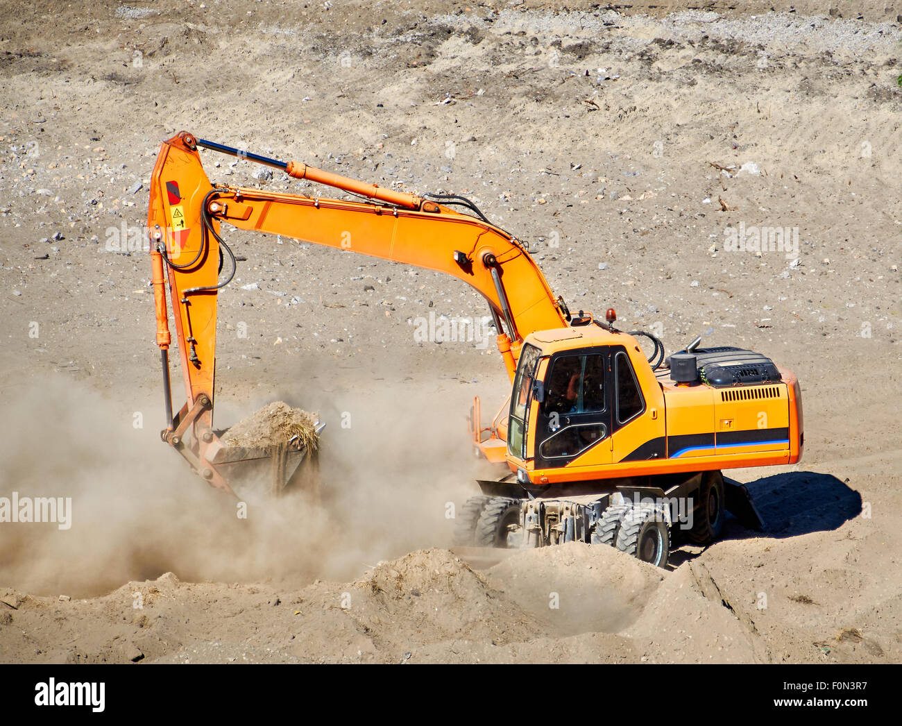Excavator bulldozer mover in action Stock Photo - Alamy