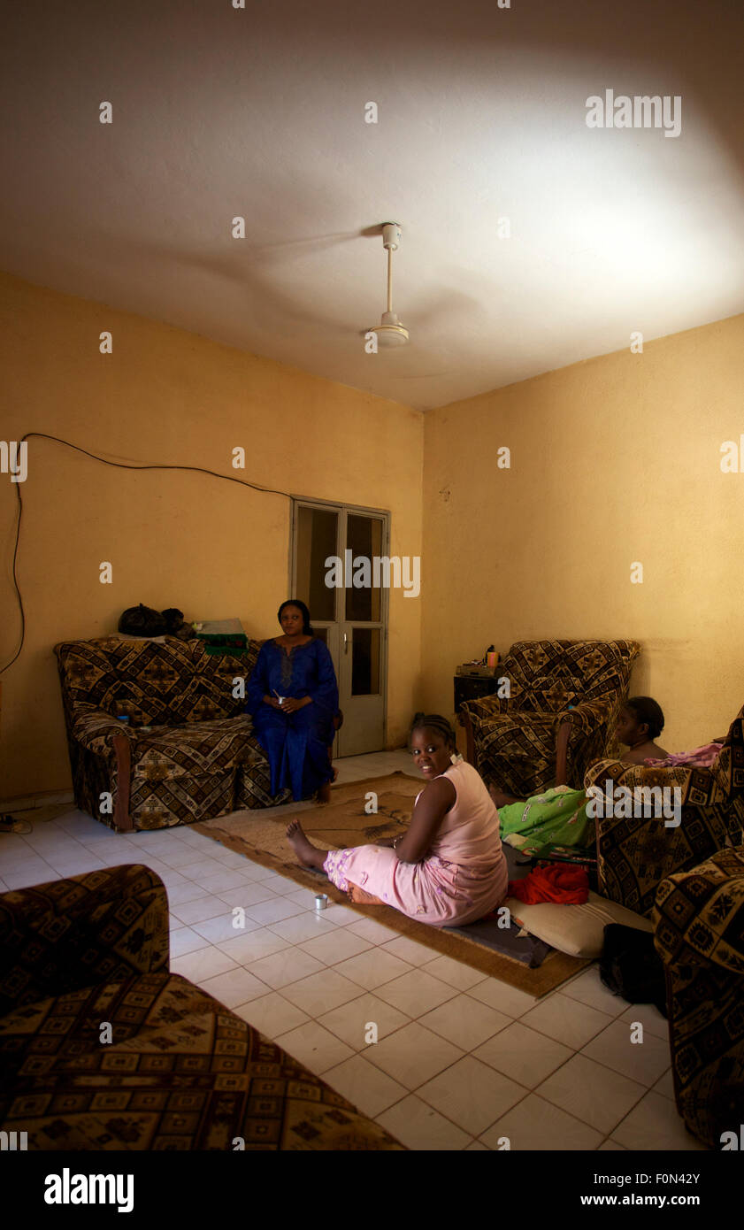 3 sisters in a traditional house in Bamako the day before Christmas in Bamako, December 23, 2010, Mali Stock Photo