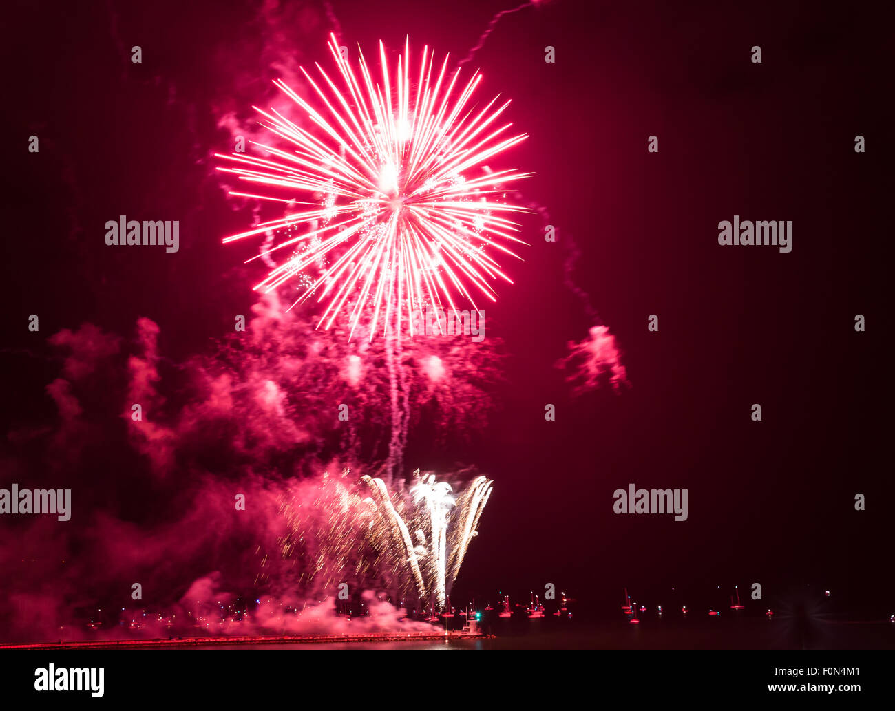 Plymouth, UK. 18th Aug, 2015. The Essex Pyrotechnics entry into the British Firework championships 18 August 2015 held at plymouth UK. Crimson red fills the sky and the wind gets up slightly for the third display on the first day of the the British Firework Championships. Credit:  Anna Stevenson/Alamy Live News Stock Photo