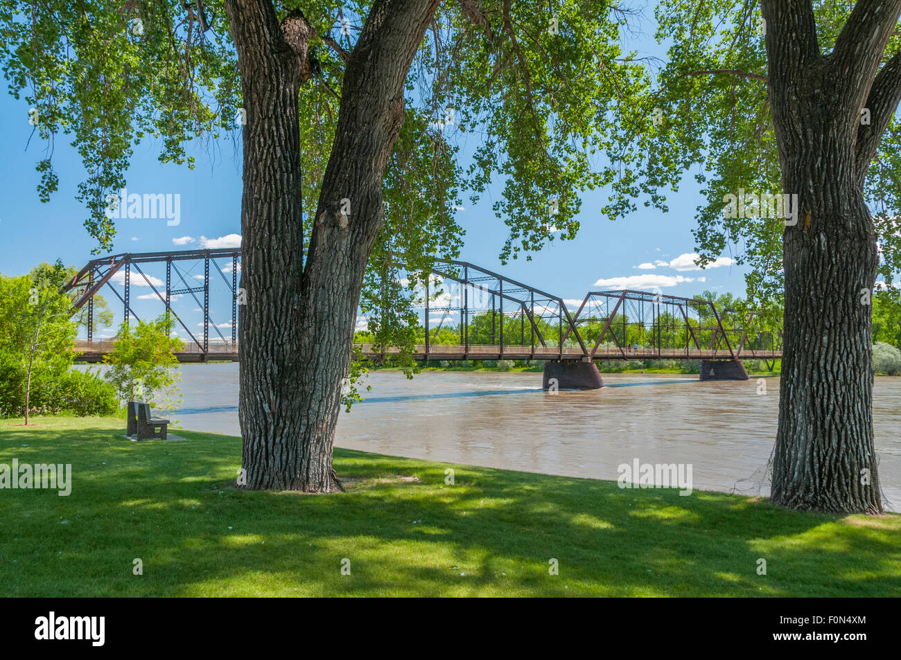 Riverfront park and historic bridge over the Missouri River in Fort Benton, Montana. Stock Photo