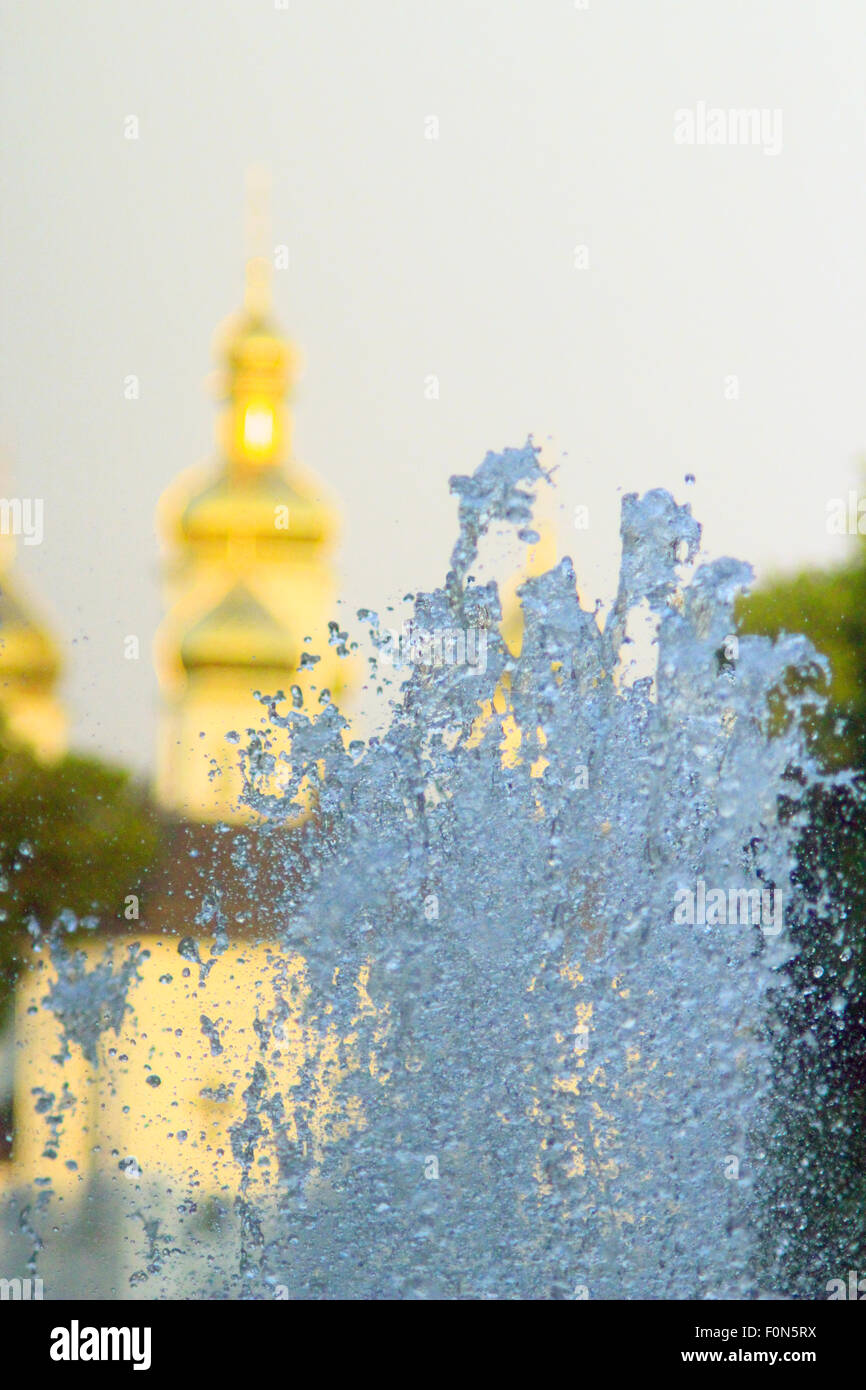 fountains on the background of beautiful golden church domes Stock Photo