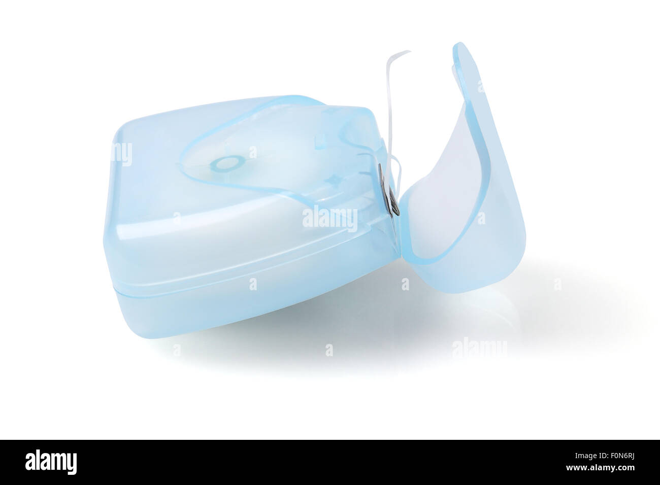 Dental Floss in Plastic Container on White Background Stock Photo - Alamy