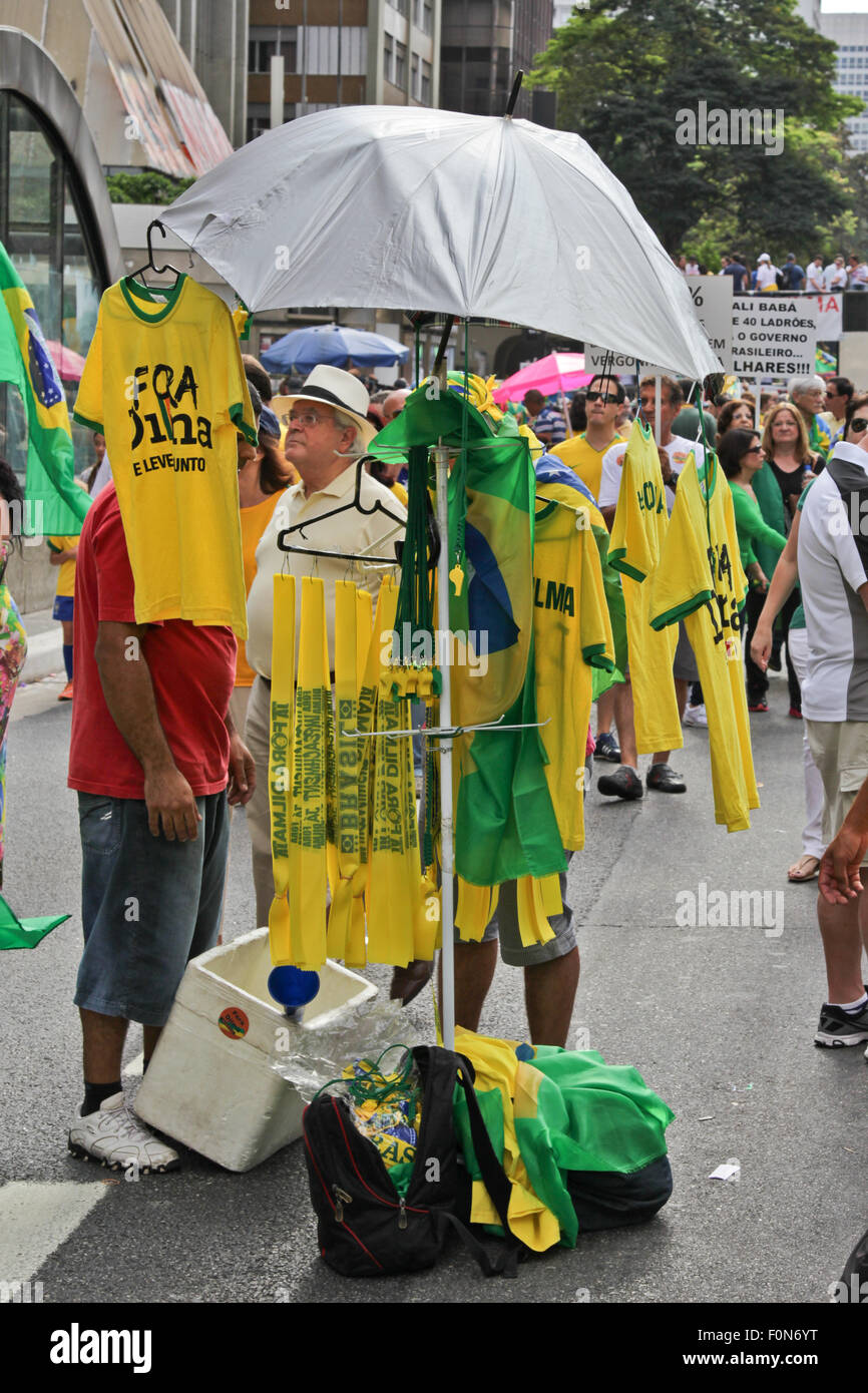 SAO PAULO, BRAZIL August 16, 2015: Flags and T-Shirts to sell in the protest against federal government corruption in Sao Paulo Stock Photo