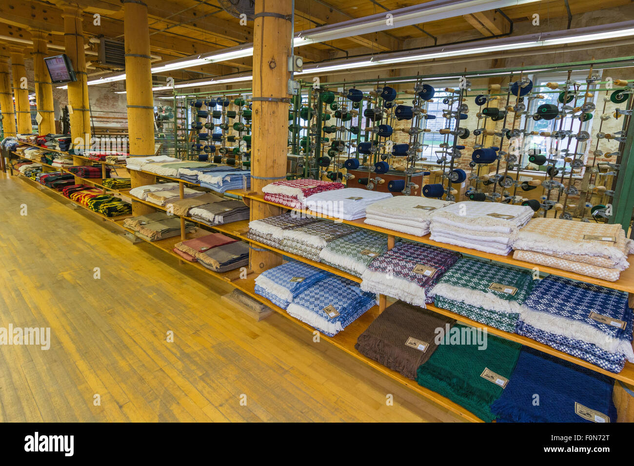 Iowa, Amana Colonies, Amana Woolen Mill, Salesroom blankets, warping creel in background Stock Photo