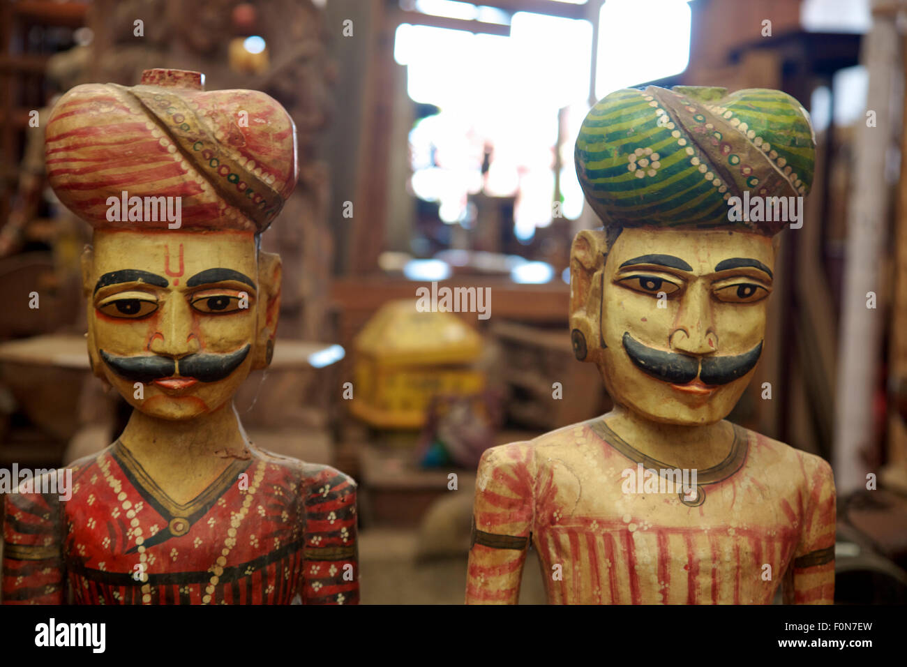 Two colored Wood sculptures in a local artisanal shop, India. Stock Photo