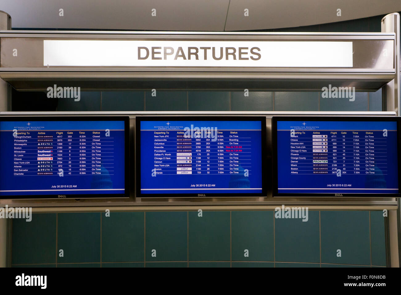 Departing flight Information display board at Ronald Reagan Washington National Airport - USA Stock Photo