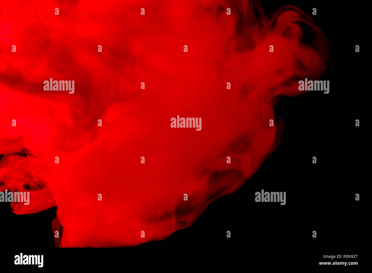 Abstract red-orange hookah smoke on a black background. Photographed