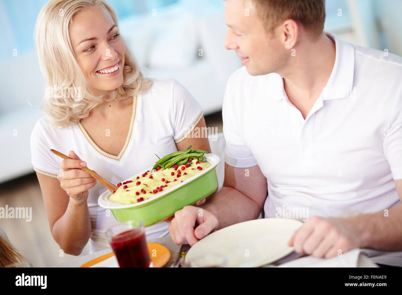 Happy married couple having dinner at home Stock Photo