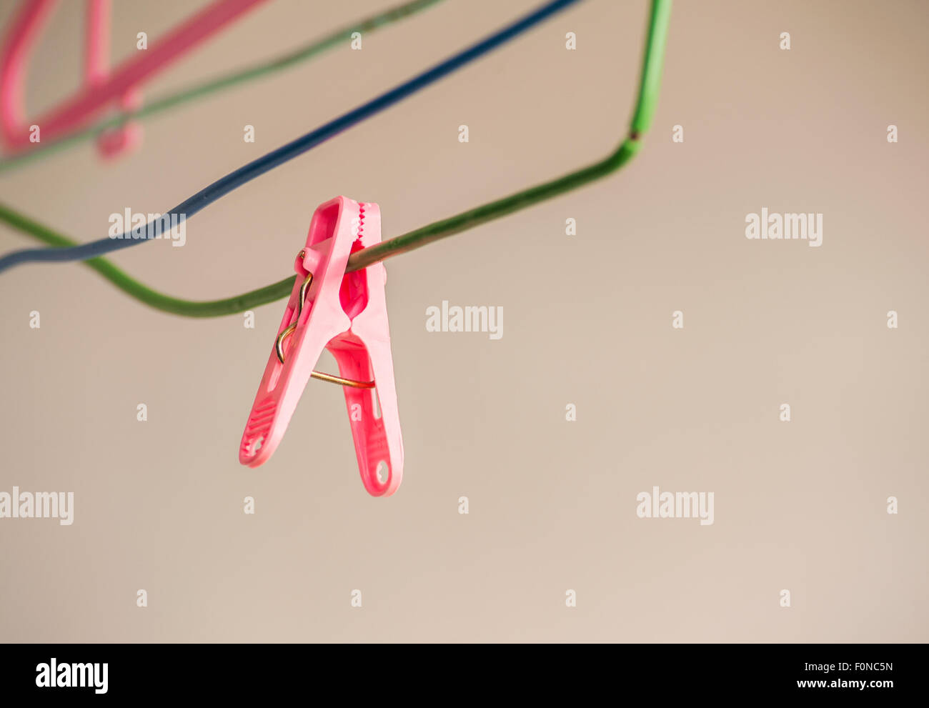 Pink clips for washing laundry clothes pegs outdoor, Selective focus Stock Photo