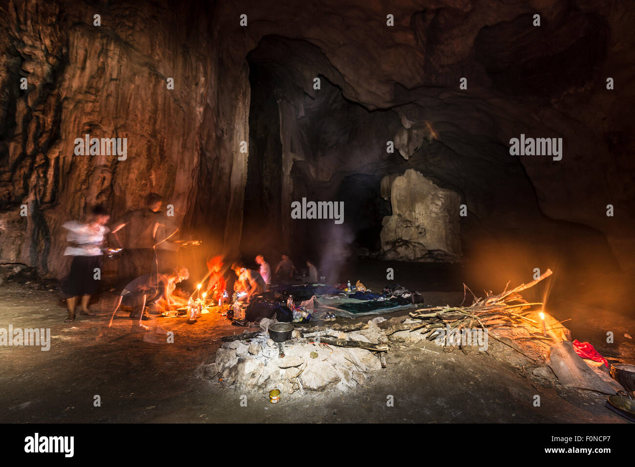 Hikers, tourists sleeping in a cave with a campfire, Kuala Tahan, Taman Negara National Park, Malaysia Stock Photo