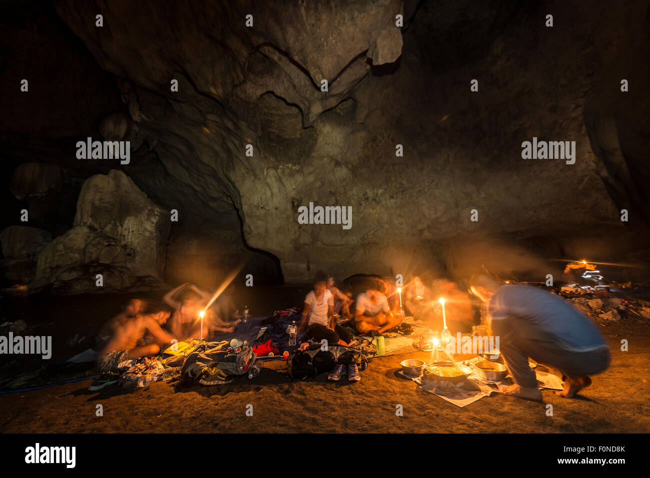 Hikers, tourists sleeping in a cave with a campfire, Kuala Tahan, Taman Negara National Park, Malaysia Stock Photo