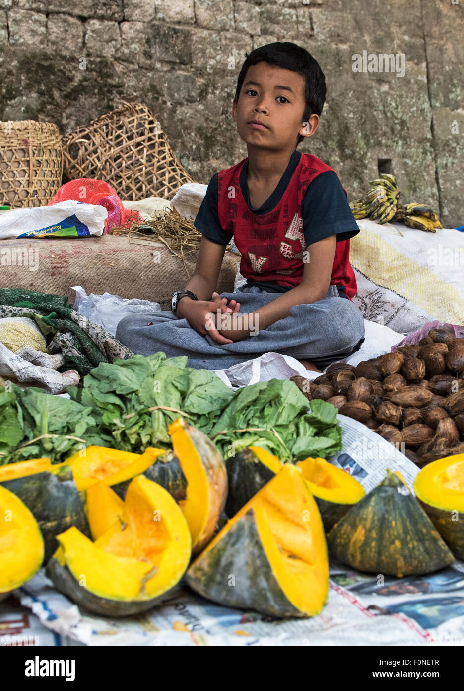 Young street seller at local Saturday market Punakha Buthan Stock Photo