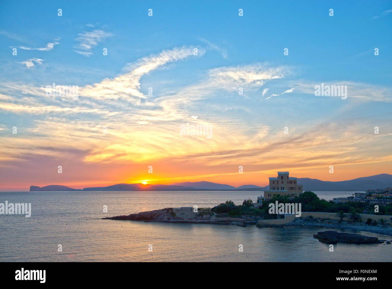 View of Hotel Las Tronas with Capocaccia cape in the background at dawn sunrise Alghero Sardinia Italy Stock Photo