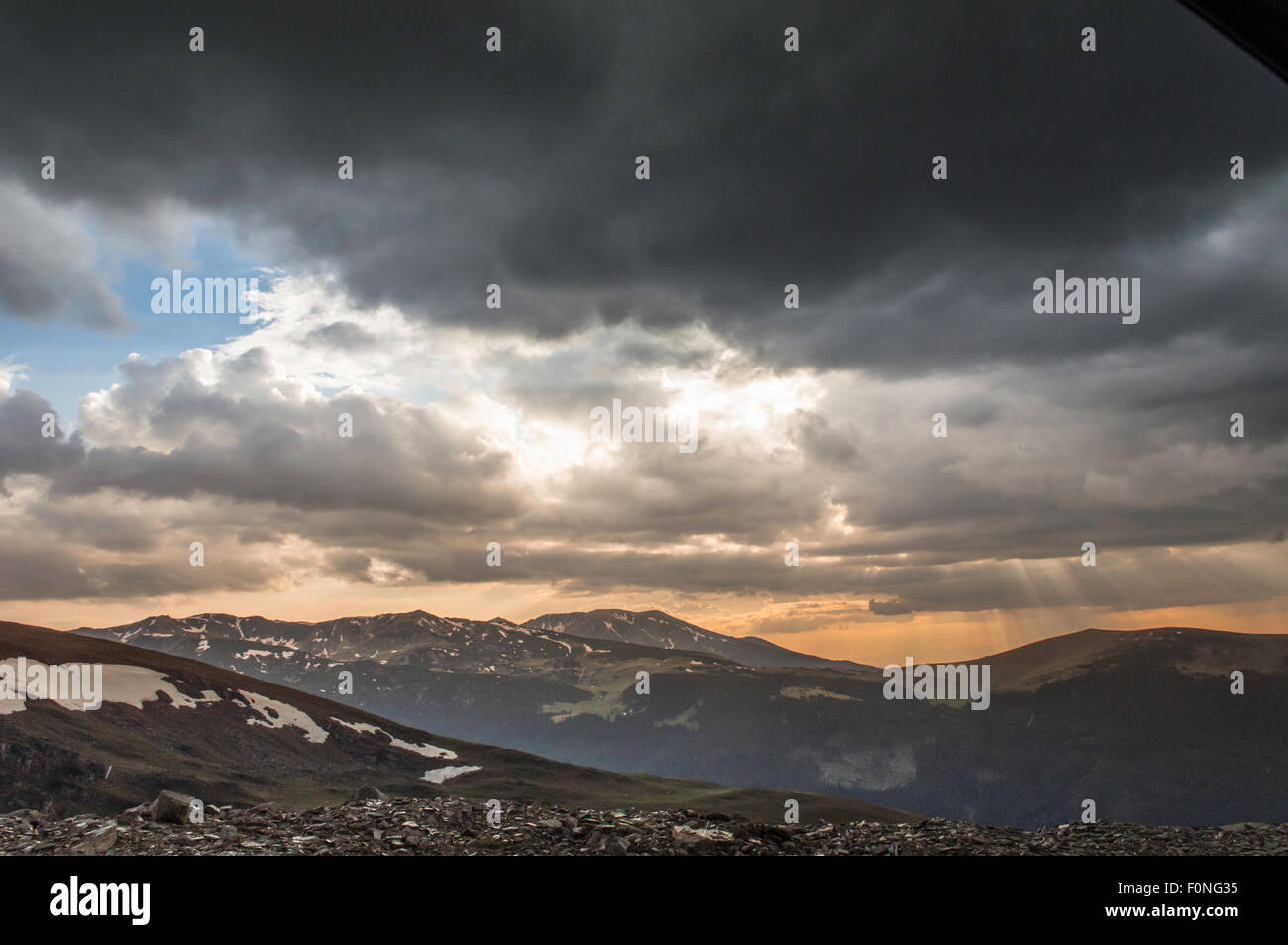 dramatic summer sunset with storm clouds in mountains Stock Photo - Alamy