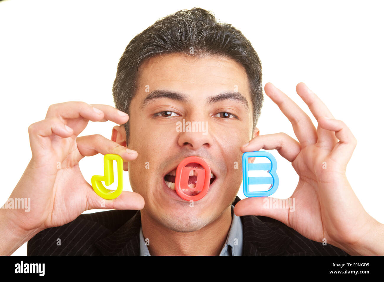 Businessman holding the letters J, O, B in his hands Stock Photo