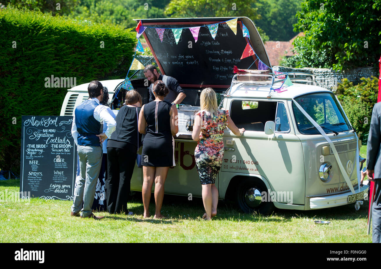 A cocktail bar made out of a vw camper van at a wedding. Stock Photo