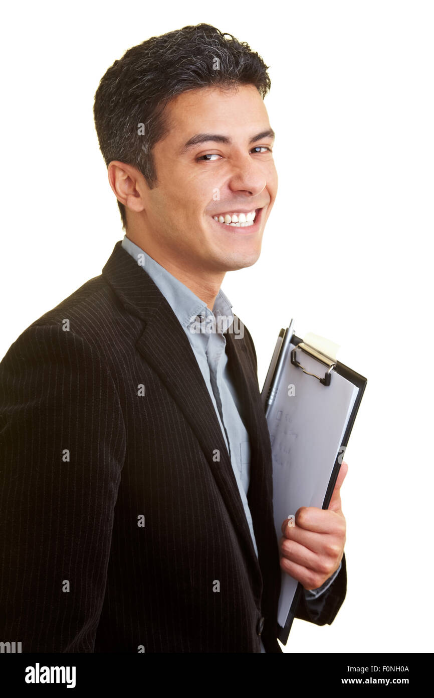 Businessman smiles with clipboard in his hand Stock Photo - Alamy