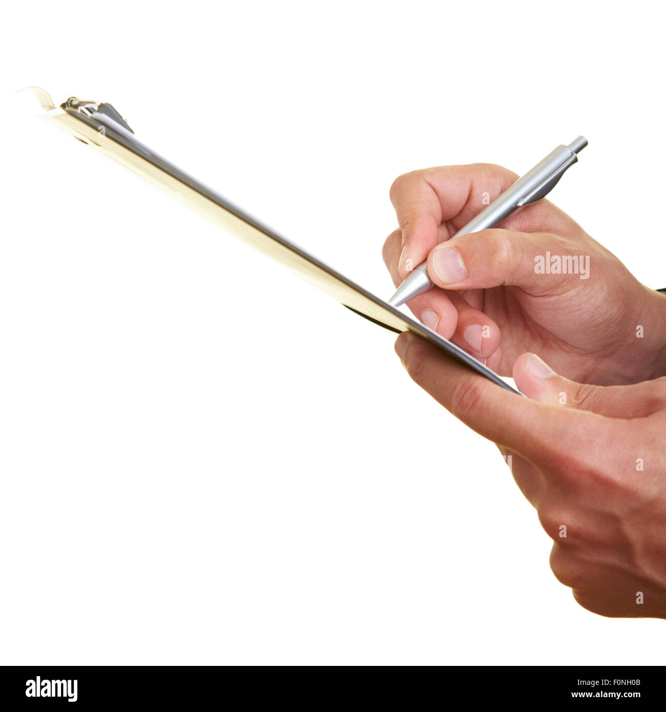 Hands holding a clipboard and writing Stock Photo