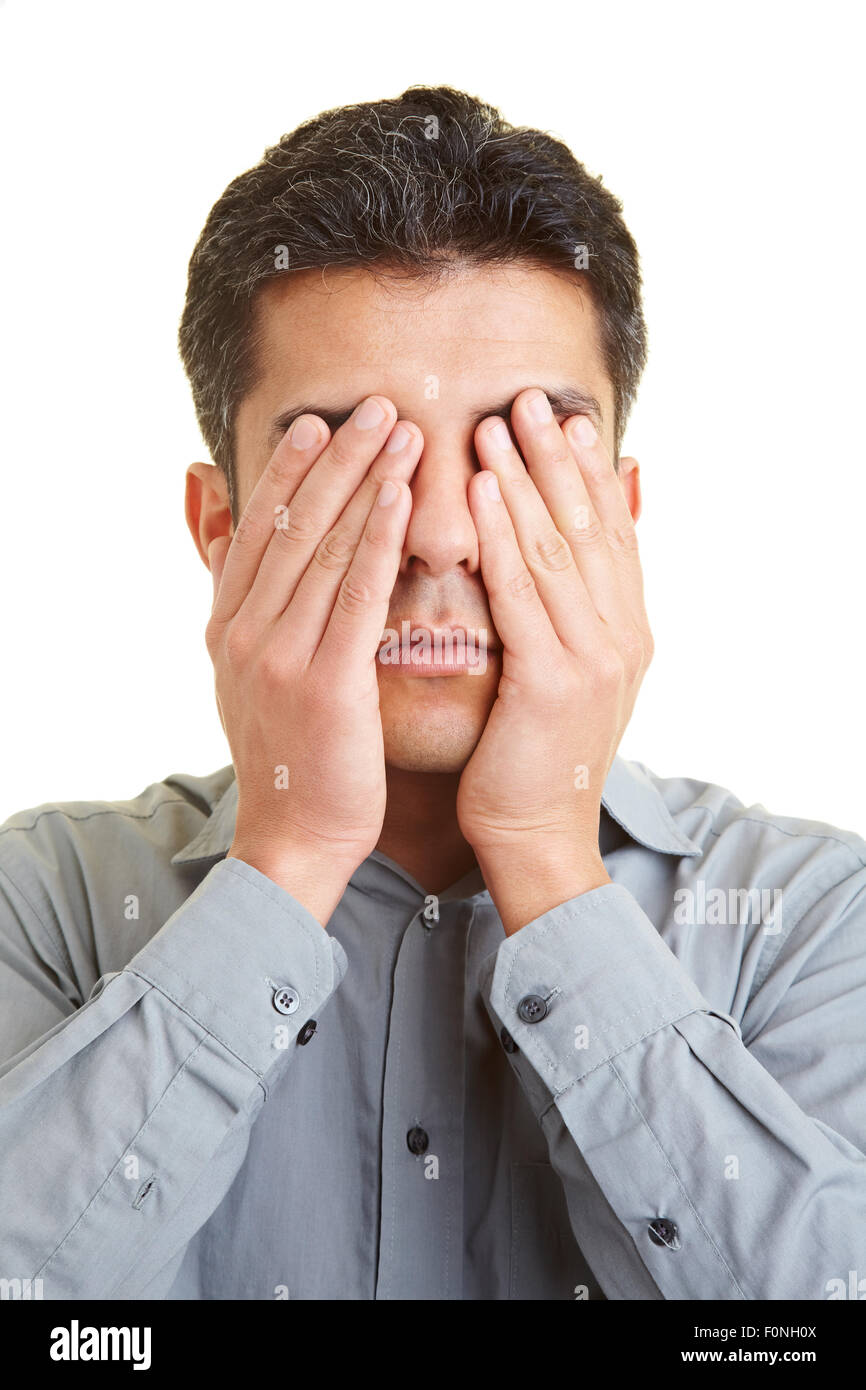Man covering his eyes with his hands Stock Photo Alamy