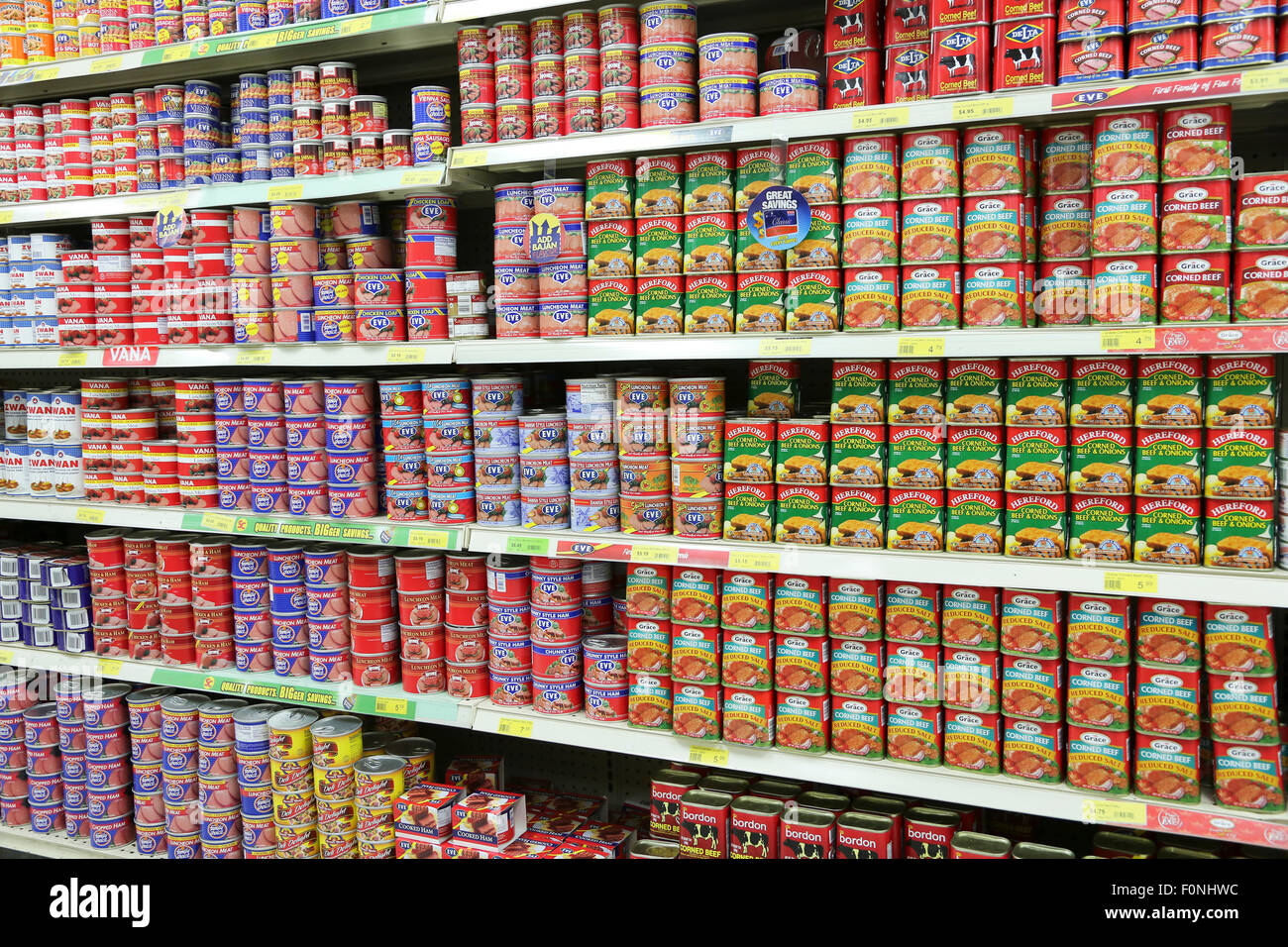 CANNED MEAT PRODUCTS IN TROPICAL SUPERMARKET Stock Photo