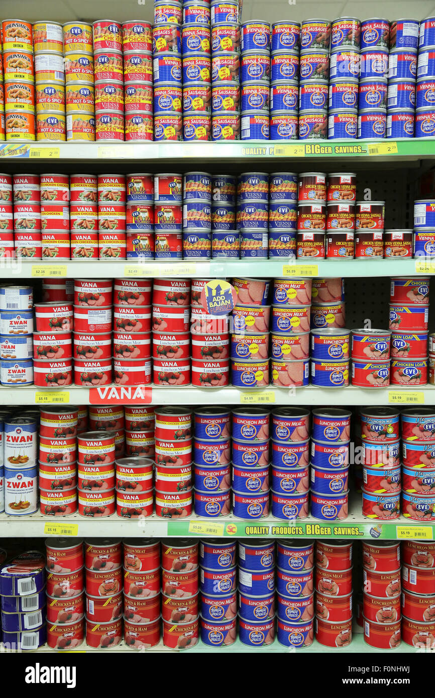 CANNED MEAT PRODUCTS IN TROPICAL SUPERMARKET Stock Photo