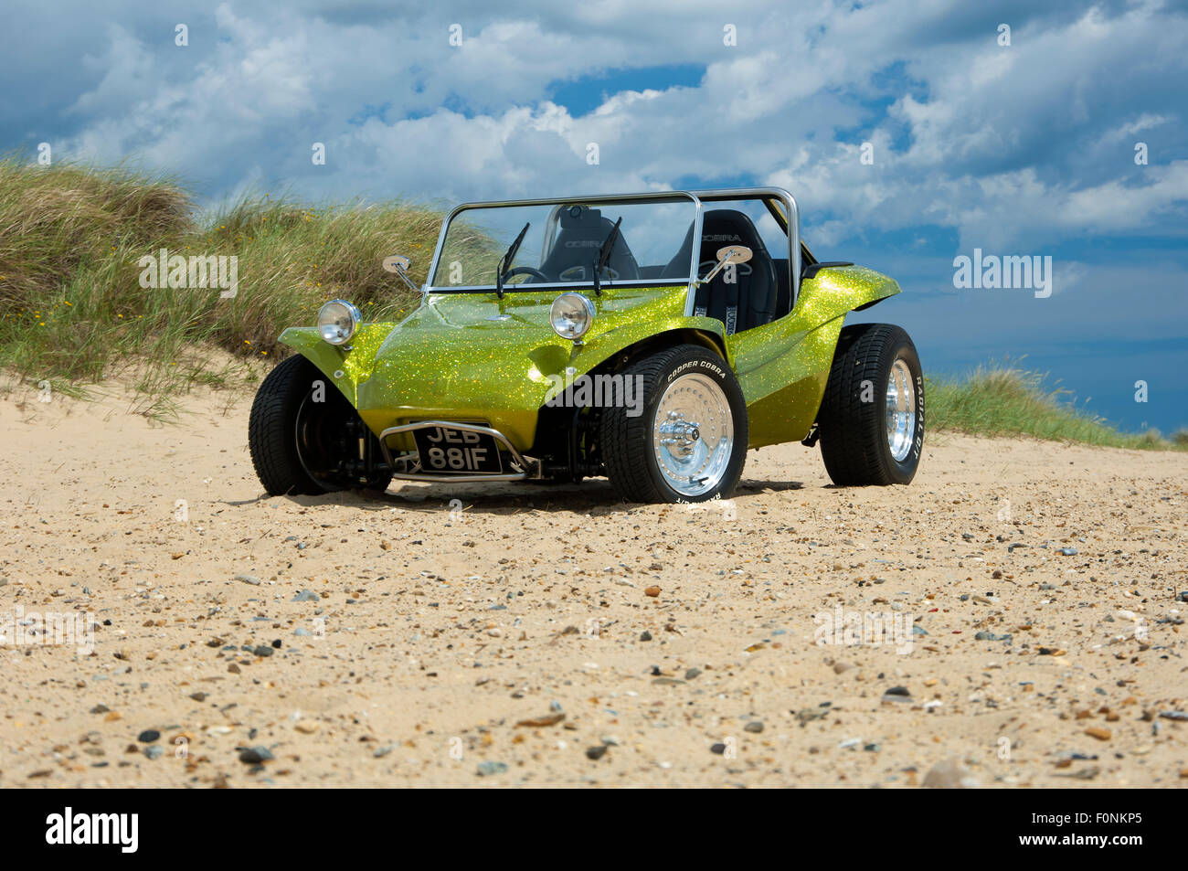 Beach buggy on a sandy beach. VW Beetle based dune buggy car Stock Photo