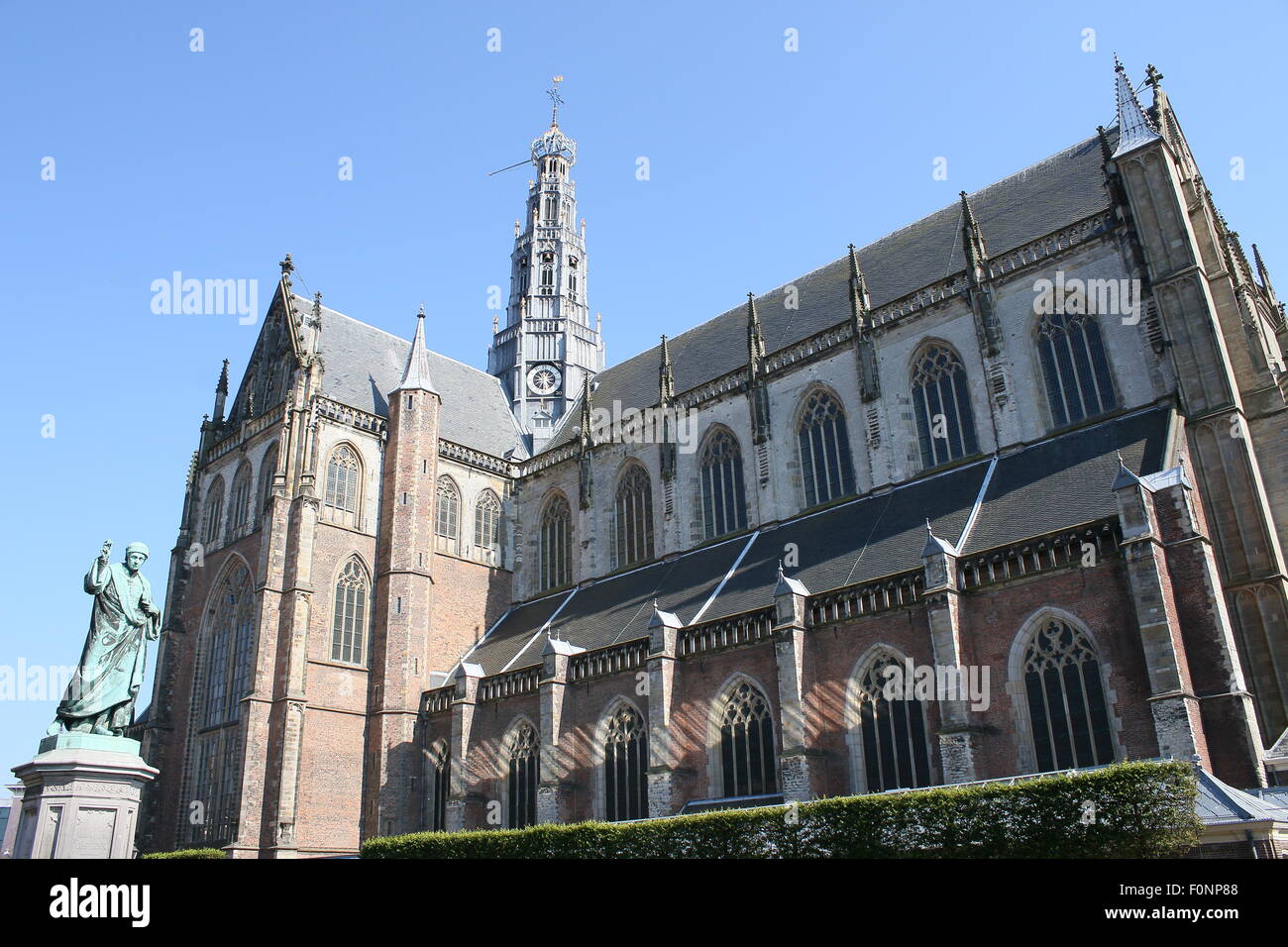 Grote or St. Bavo church, on Grote Markt square in the city of  Haarlem, Netherlands. Statue of Laurens Janszoon Coster Stock Photo