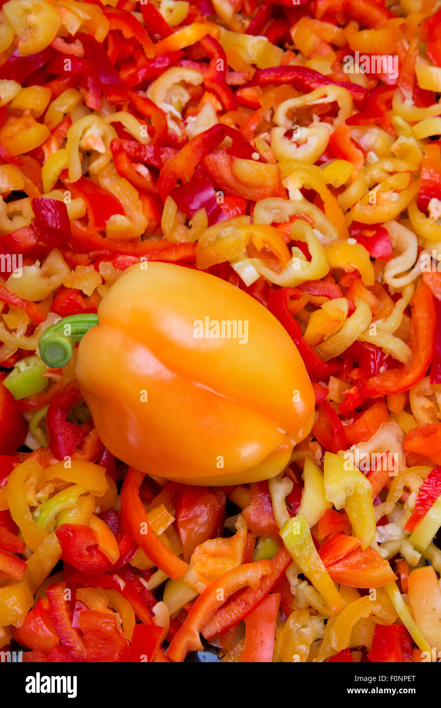 colorful bell pepper slices and whole fruit Stock Photo