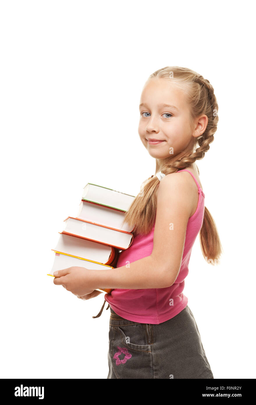 Happy little schoolgirl with a stack of heavy books Stock Photo - Alamy