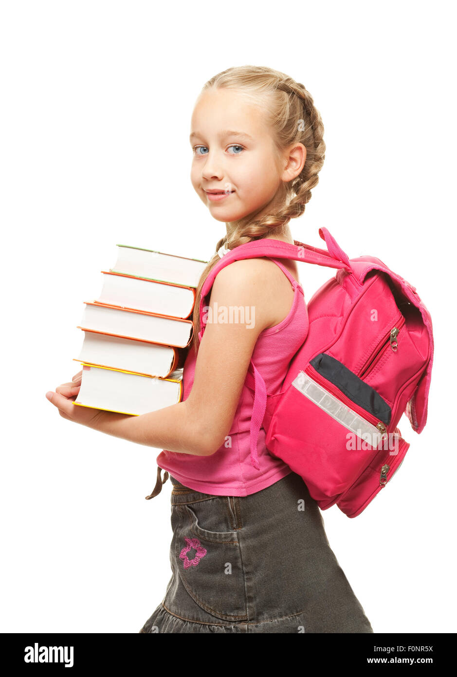 Happy little schoolgirl with a stack of heavy books Stock Photo - Alamy