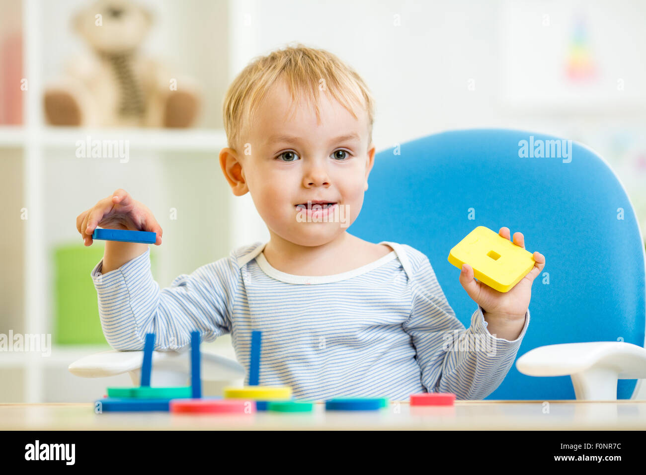 kid plays with education toys Stock Photo - Alamy
