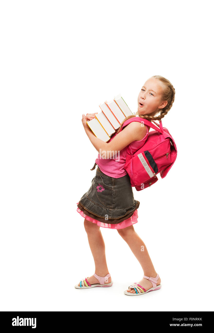 Happy little schoolgirl with a stack of heavy books Stock Photo - Alamy