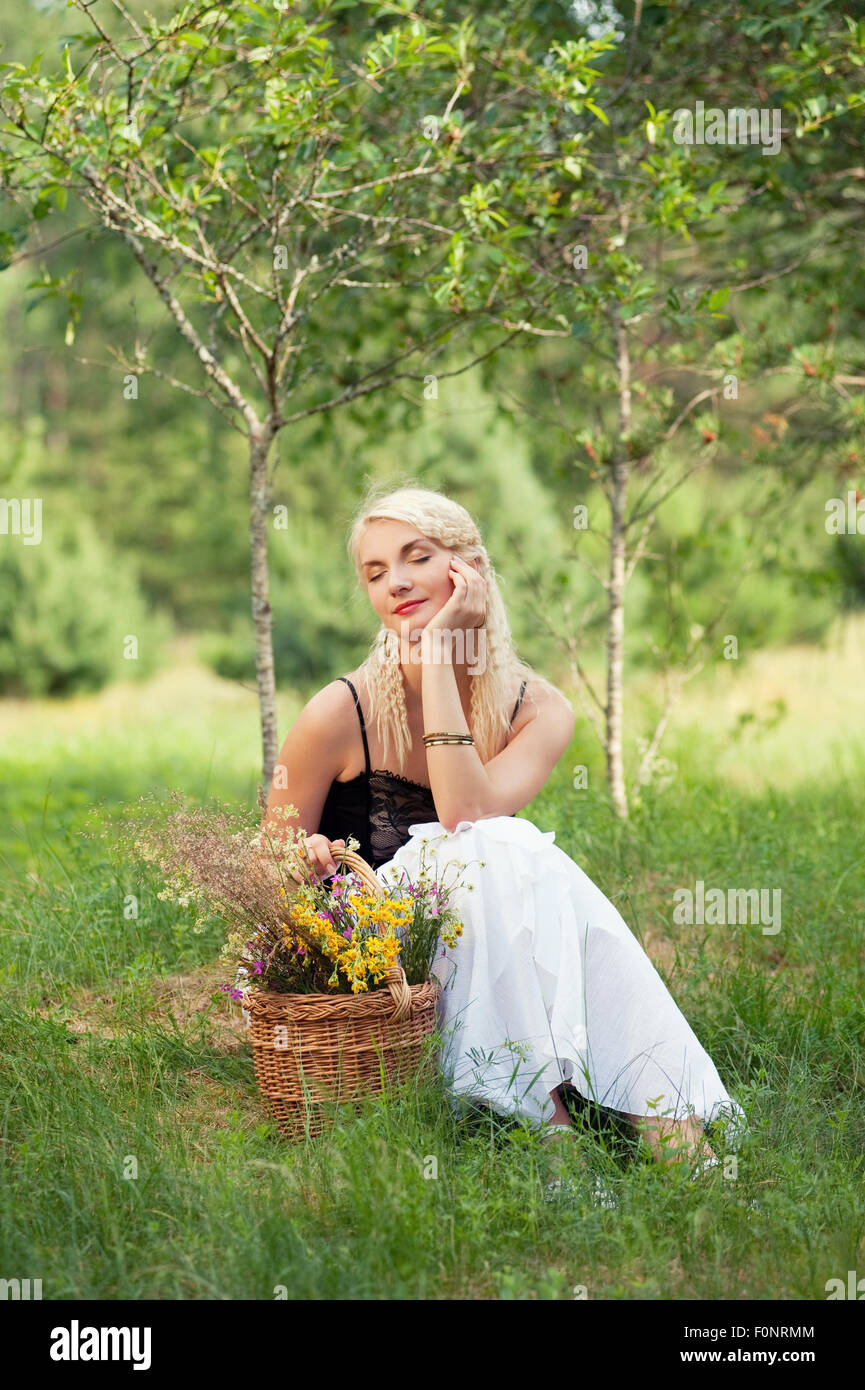 Beautiful woman relaxing outdoor Stock Photo - Alamy