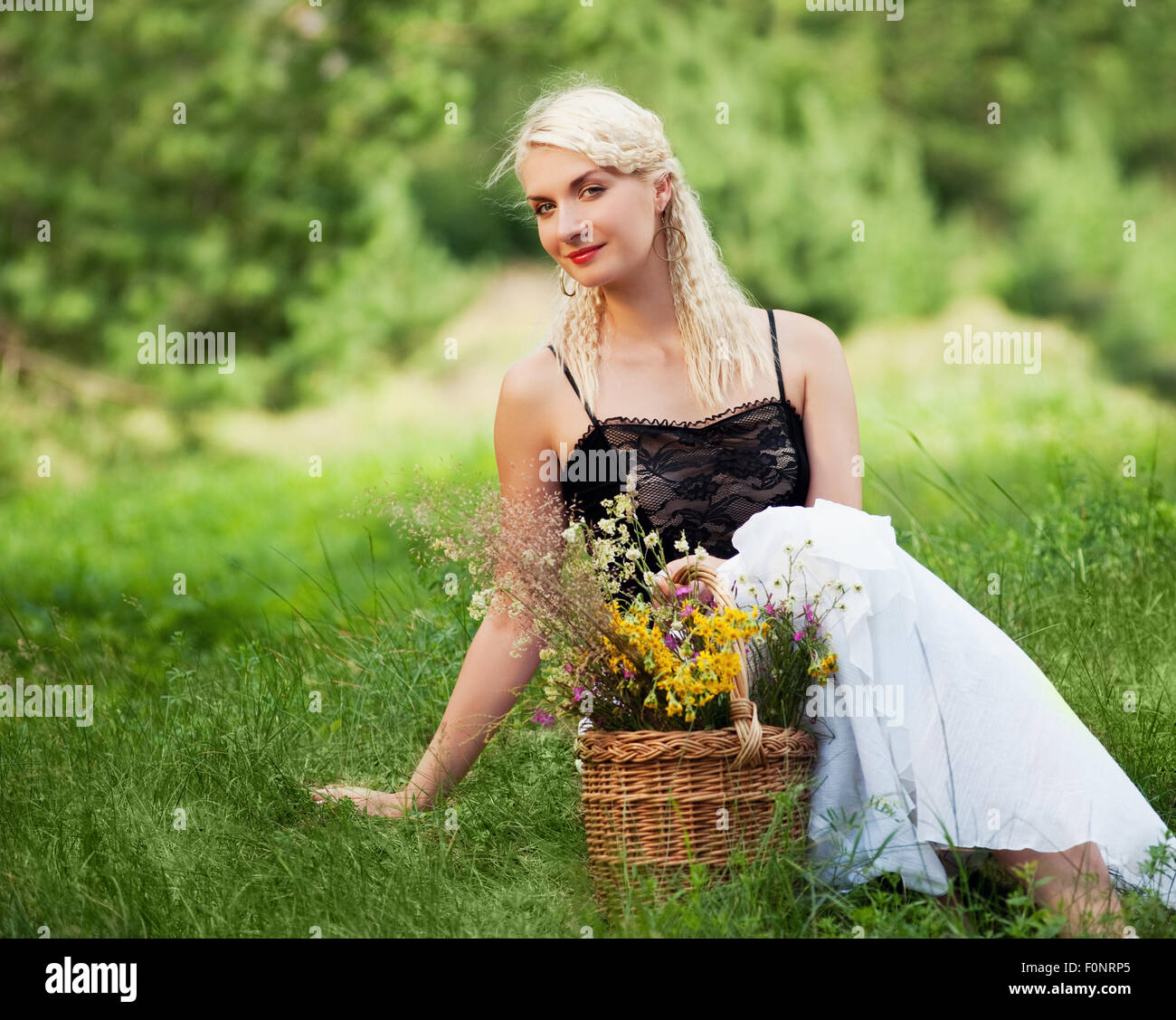 Beautiful woman relaxing outdoor Stock Photo - Alamy