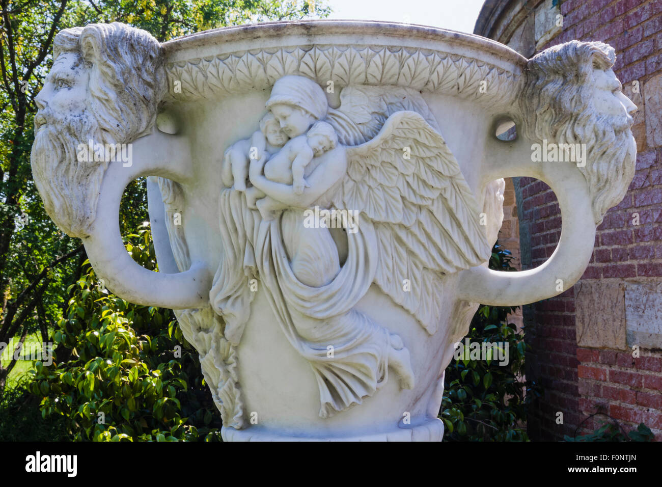 England, Kent, Hever, Hever Castle, The Italian Garden, Marble Urn with Angel Carrying Children Stock Photo