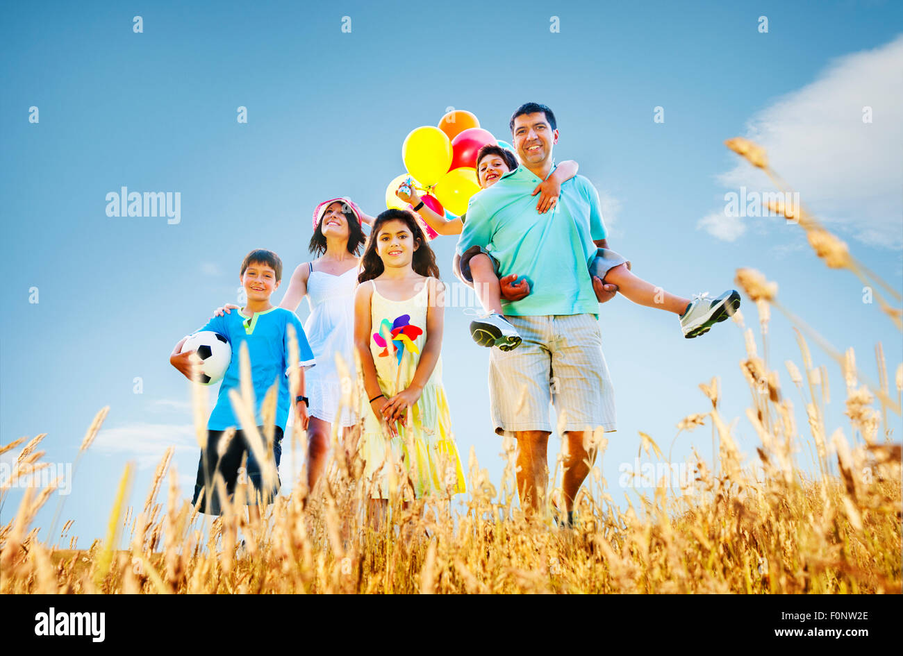 Family Playing Outdoors Children Field Concept Stock Photo - Alamy