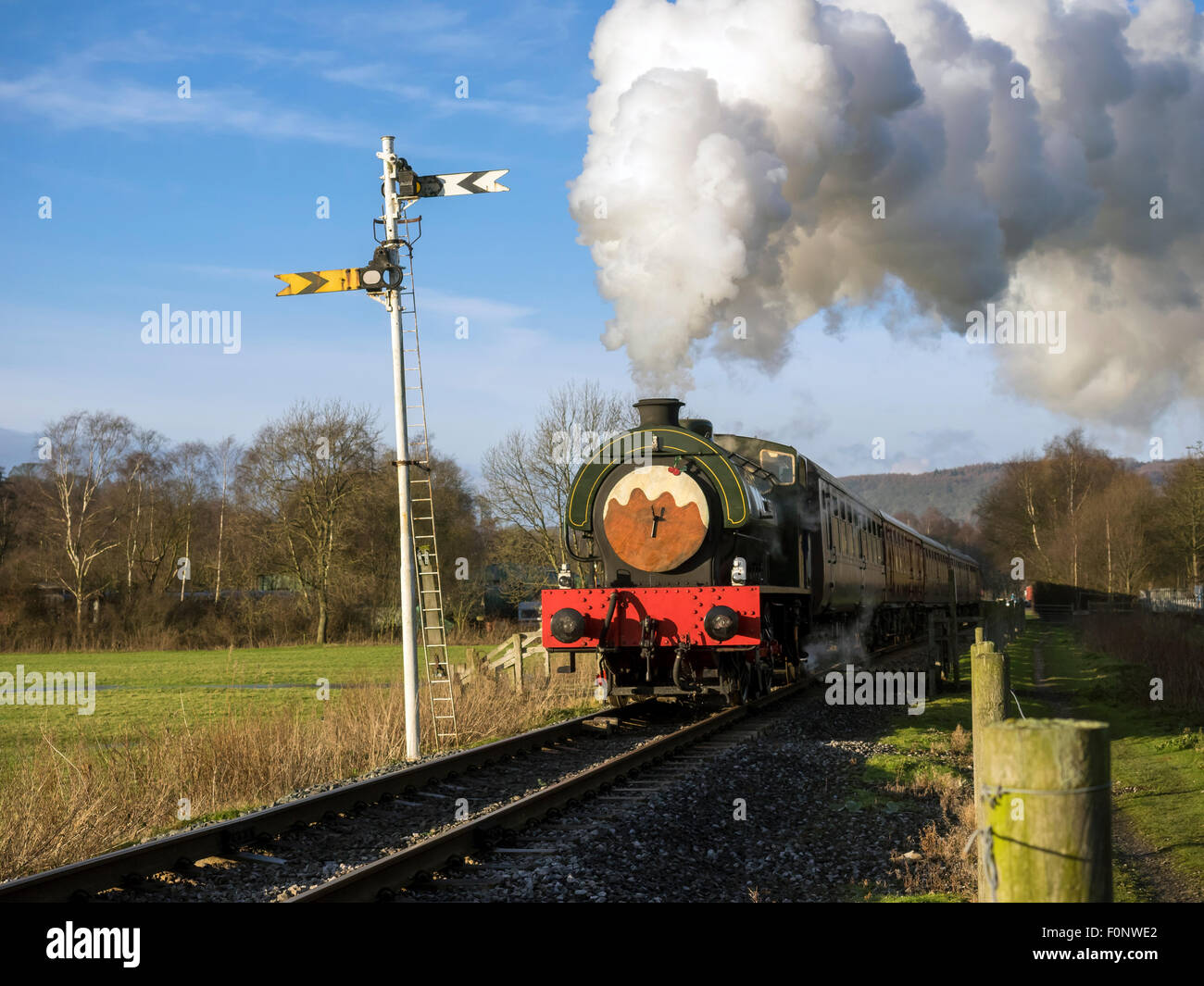 Steam train running on track in Derbyshire England Stock Photo Alamy