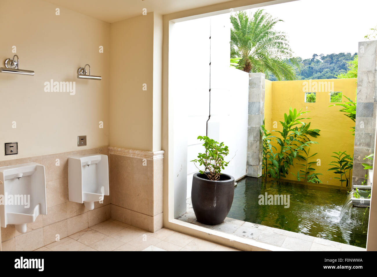 Male toilet with water feature Stock Photo