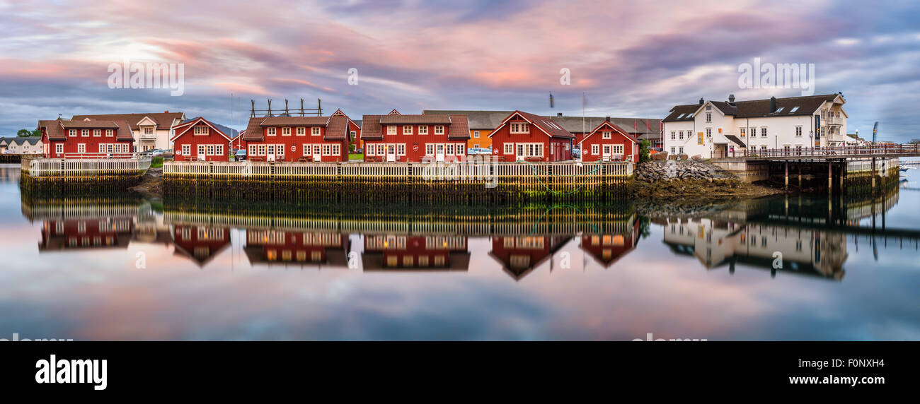 Typical red harbor houses in Svolvaer at sunset. Svolvaer is located  in Nordland County on the island of Austvagoya Stock Photo