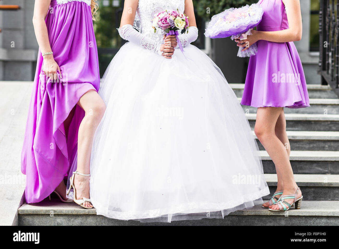 Two bridesmaids holding bouquet hi-res stock photography and images - Alamy
