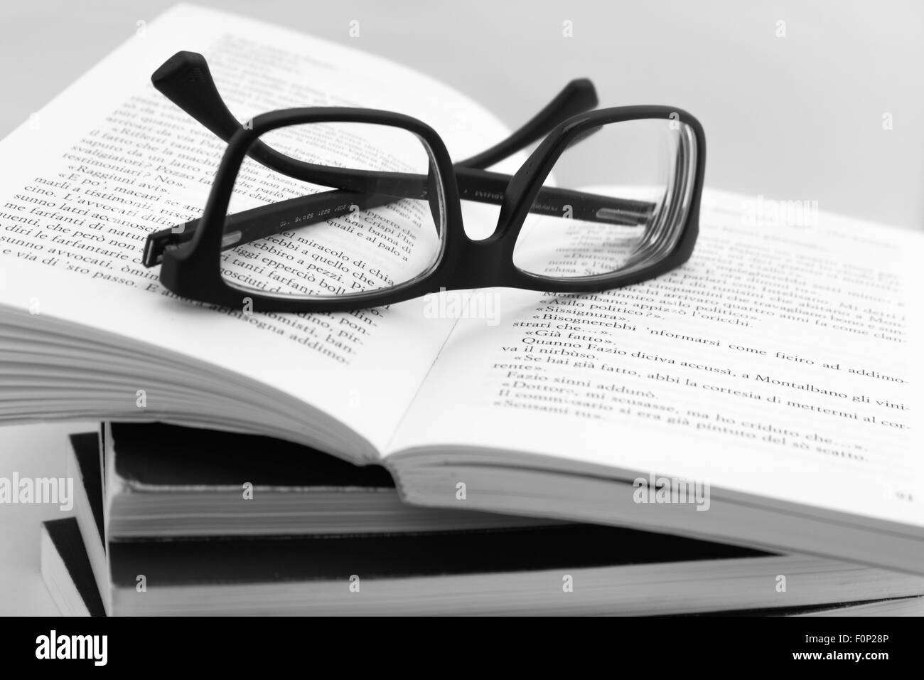 We are going to read books. Books and glasses on white background. Stock Photo