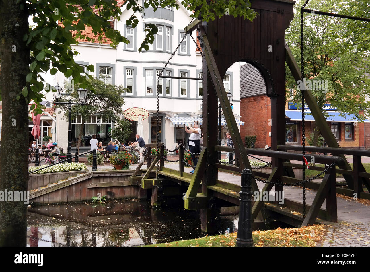 Authentic wooden drawbridge across the Papenburg Hauptkanal in the center of Papenburg, Germany Stock Photo