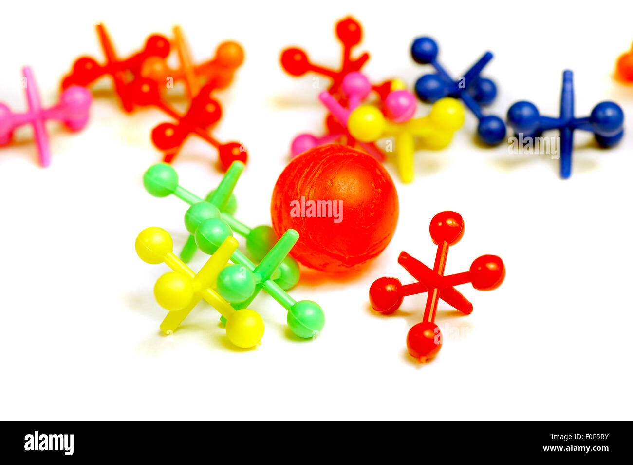 Jacks and ball isolated on a white background Stock Photo