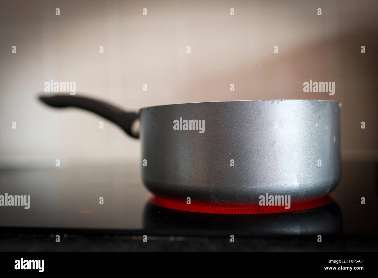 a pan on an electric hob Stock Photo Alamy