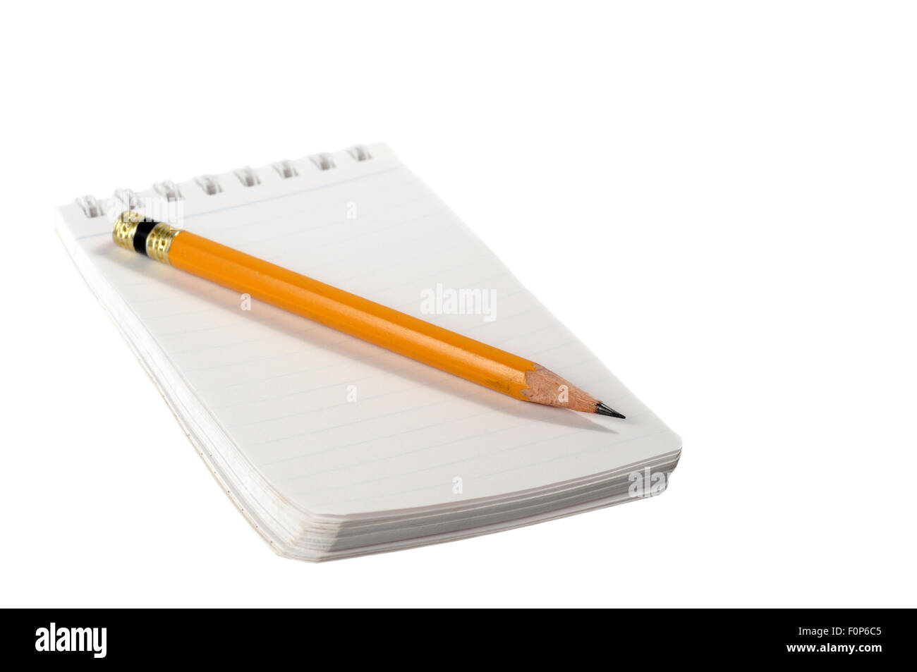 Yellow pencil and notepad isolated on white Stock Photo