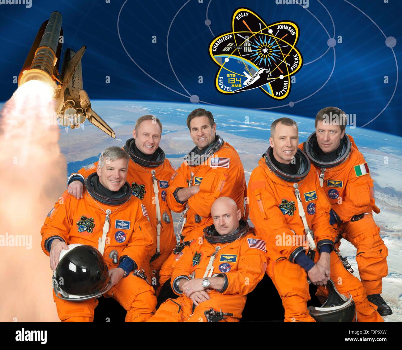 Group portrait of the STS-134 space shuttle crew astronauts in launch-and-entry suits are Mark Kelly (bottom center), commander; Gregory H. Johnson, pilot; Michael Fincke, Greg Chamitoff, Andrew Feustel and European Space Agency's Roberto Vittori at the Johnson Space Center January 1, 2010 in Houston, Texas. Stock Photo
