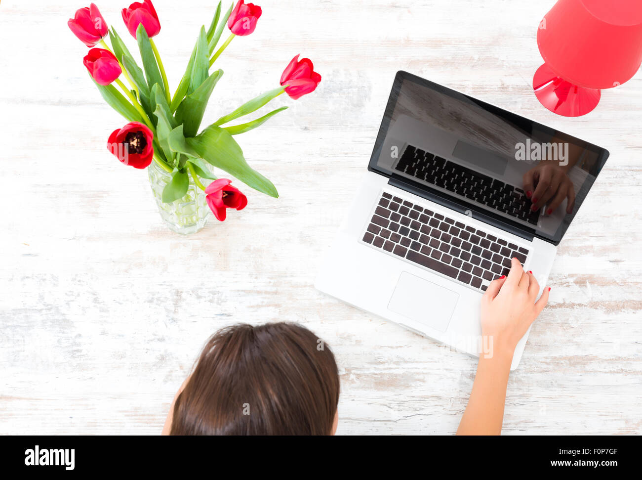 A young beautiful woman using a Laptop computer at home Stock Photo - Alamy