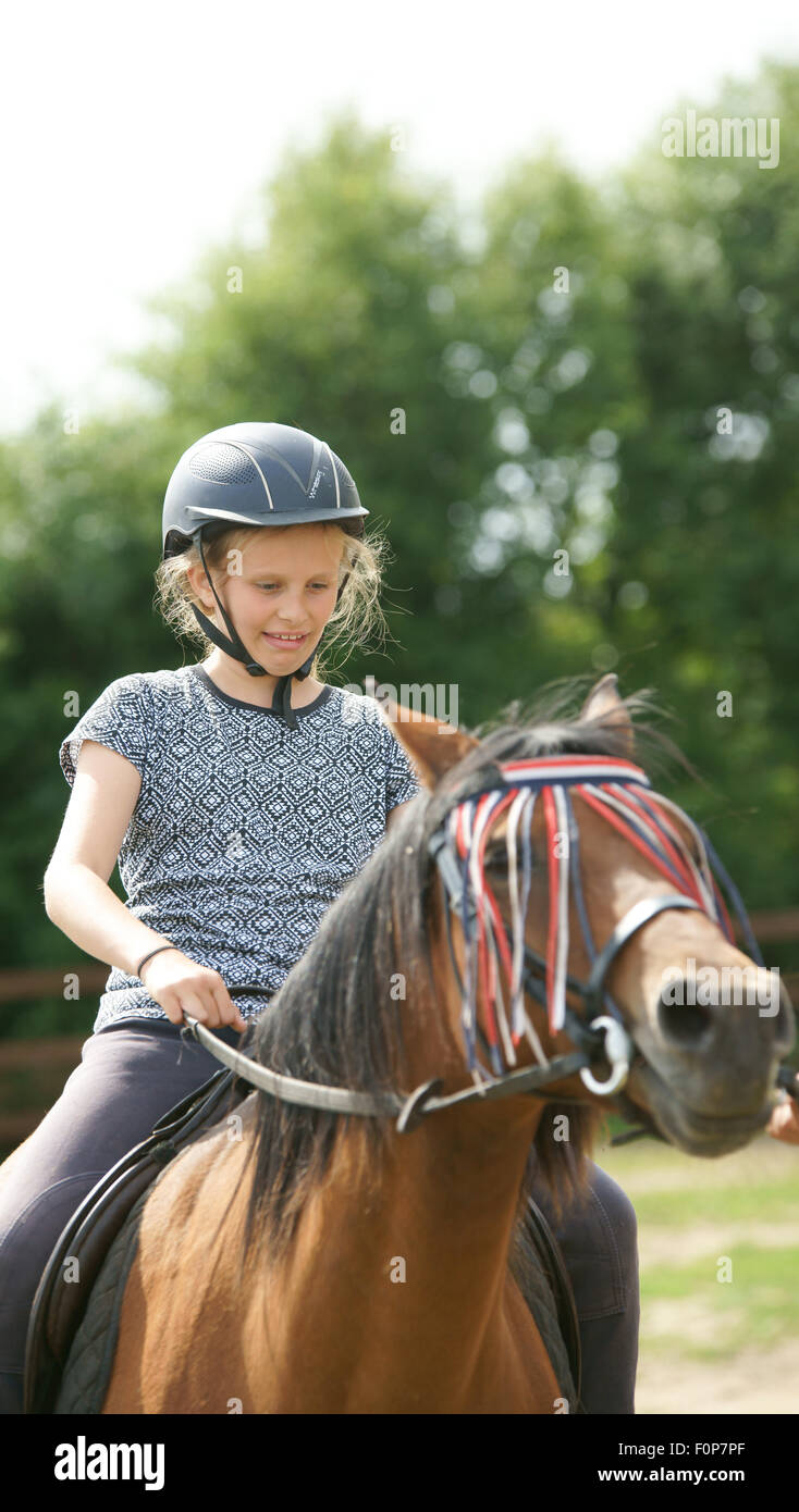 first horse riding lesson Stock Photo Alamy